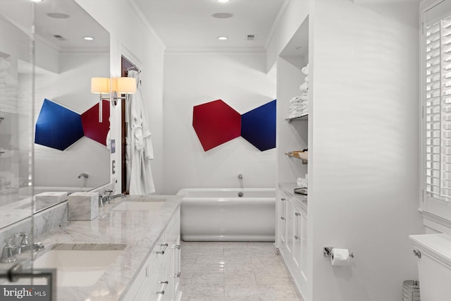 full bathroom featuring marble finish floor, ornamental molding, a garden tub, and a sink