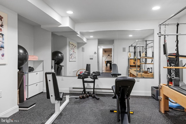 exercise area with baseboard heating, recessed lighting, and baseboards