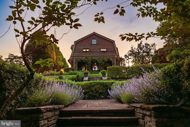 back of property with a gambrel roof