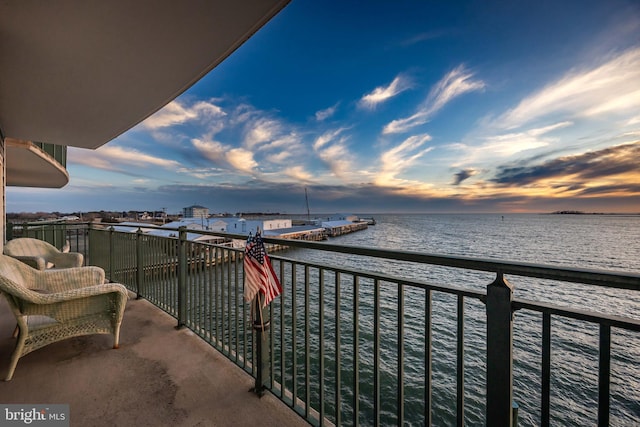 balcony at dusk with a water view