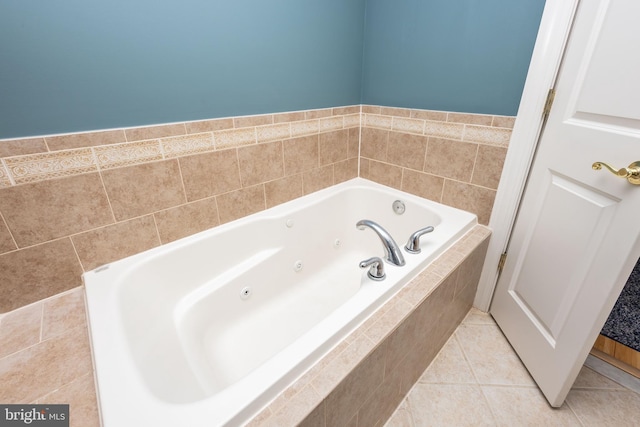 full bath featuring tile patterned floors and a jetted tub