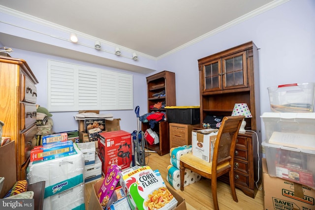 interior space with light wood-style floors and crown molding