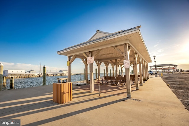 view of property's community with a gazebo and a water view