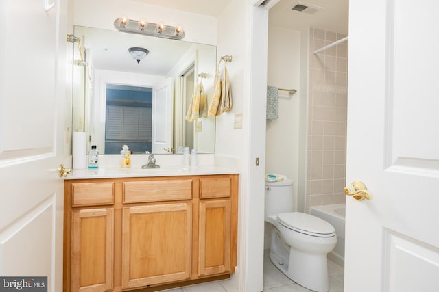 full bathroom featuring visible vents, toilet, washtub / shower combination, tile patterned flooring, and vanity