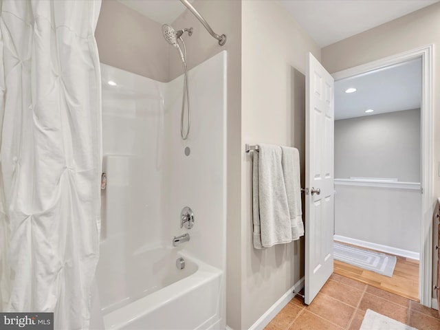 bathroom with baseboards, recessed lighting, tile patterned floors, and shower / bathtub combination with curtain