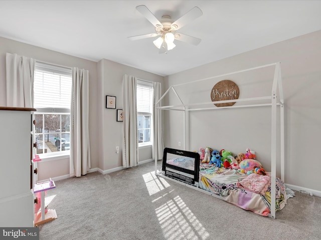 bedroom with carpet floors, baseboards, and a ceiling fan