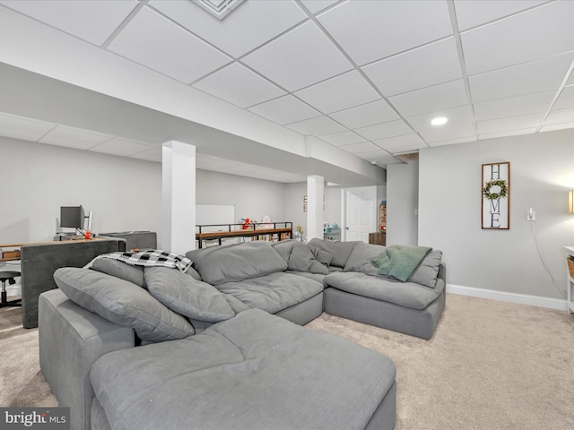 living area featuring a paneled ceiling, recessed lighting, baseboards, and light colored carpet