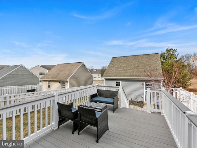 wooden deck with an outdoor hangout area