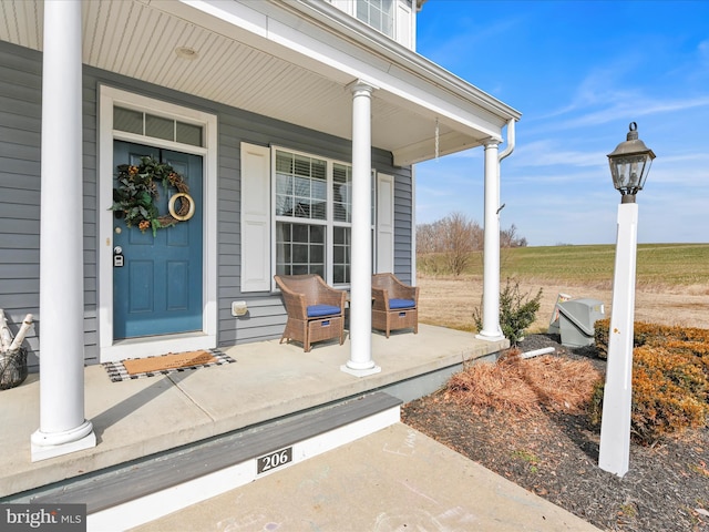 doorway to property featuring a porch