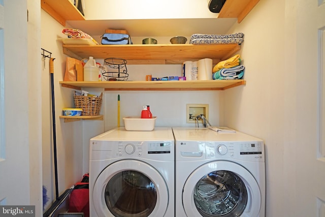 clothes washing area with laundry area and washing machine and clothes dryer