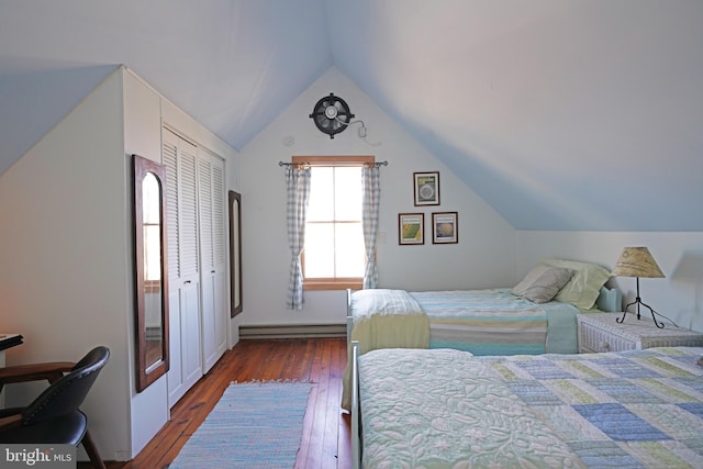 bedroom with lofted ceiling, dark wood-type flooring, a closet, and a baseboard radiator