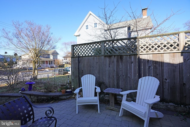 view of patio / terrace featuring fence