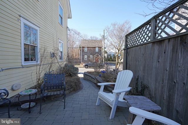 view of patio / terrace featuring fence