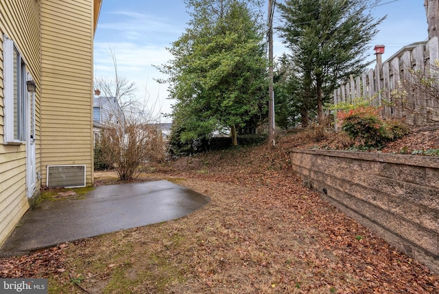 view of yard featuring a patio area and fence