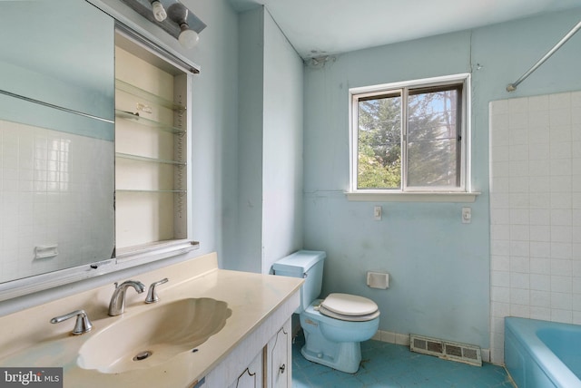 bathroom with visible vents, vanity, toilet, and tile patterned floors