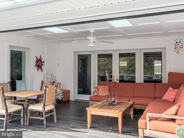 wooden terrace featuring outdoor dining space, french doors, outdoor lounge area, and ceiling fan