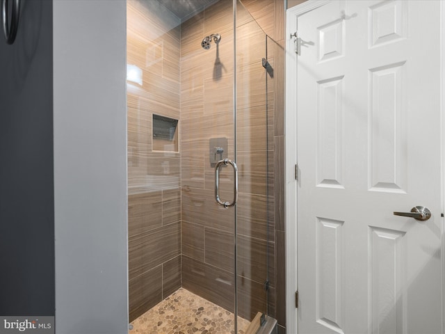 full bath featuring a shower stall