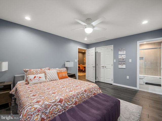 bedroom featuring connected bathroom, baseboards, recessed lighting, wood finished floors, and a closet