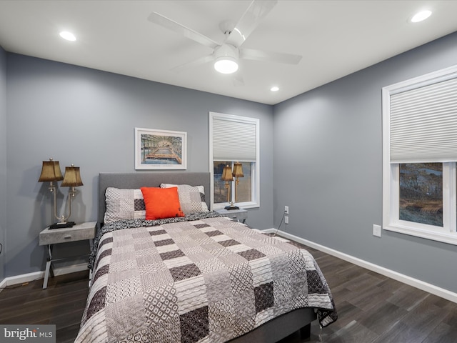 bedroom with recessed lighting, wood finished floors, and baseboards