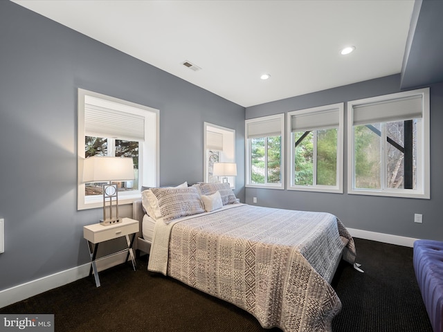 bedroom with recessed lighting, multiple windows, baseboards, and visible vents