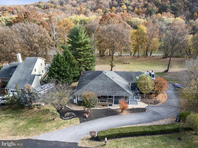 aerial view featuring a view of trees