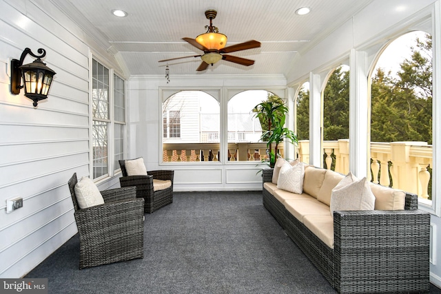 sunroom with a ceiling fan