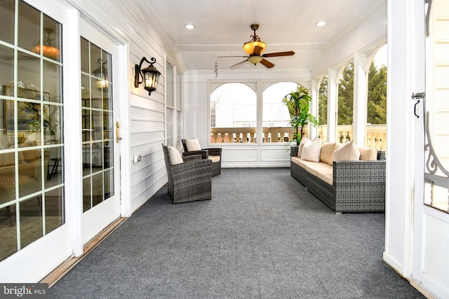 sunroom / solarium with ceiling fan