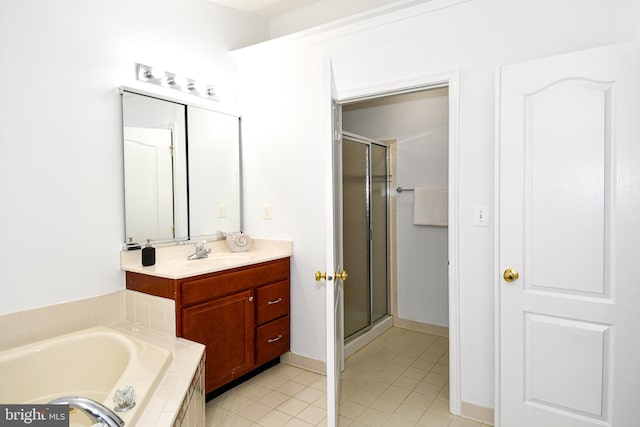 bathroom featuring vanity, tile patterned flooring, a bath, and a shower stall