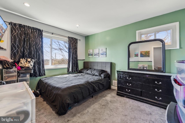 carpeted bedroom with visible vents