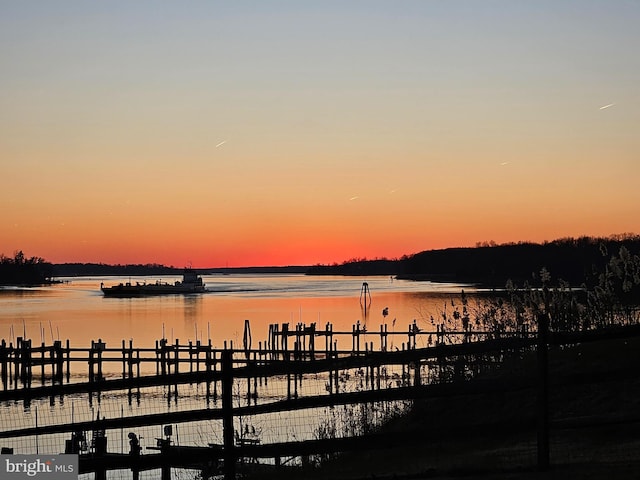 view of dock with a water view