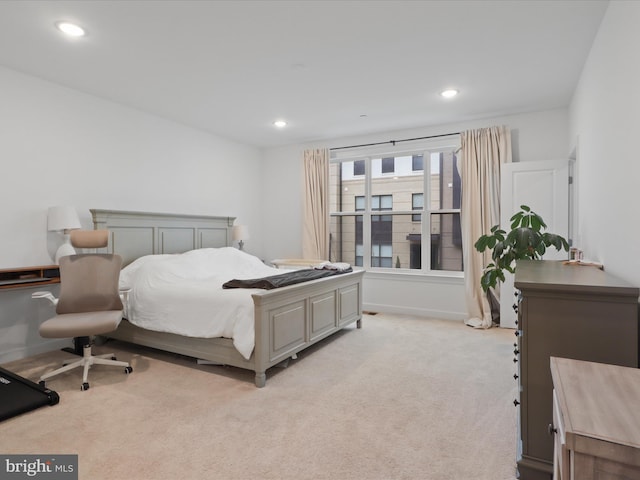 bedroom featuring recessed lighting, baseboards, and light colored carpet