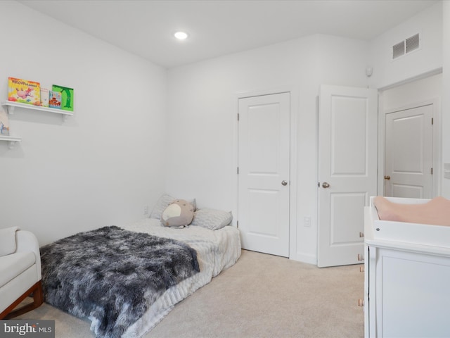 bedroom featuring recessed lighting, visible vents, and light colored carpet