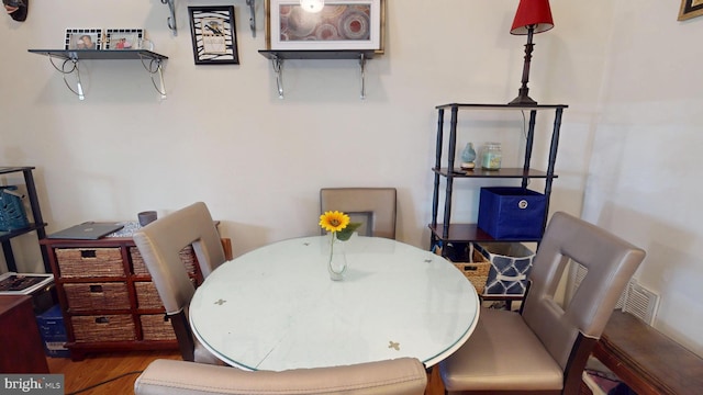 dining area with wood finished floors