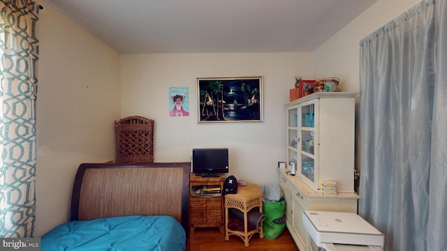 bedroom featuring wood finished floors