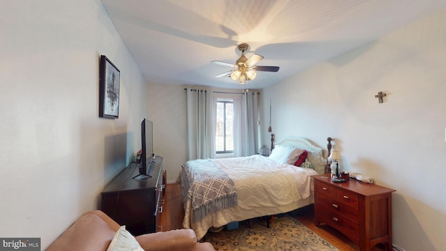 bedroom featuring ceiling fan and wood finished floors