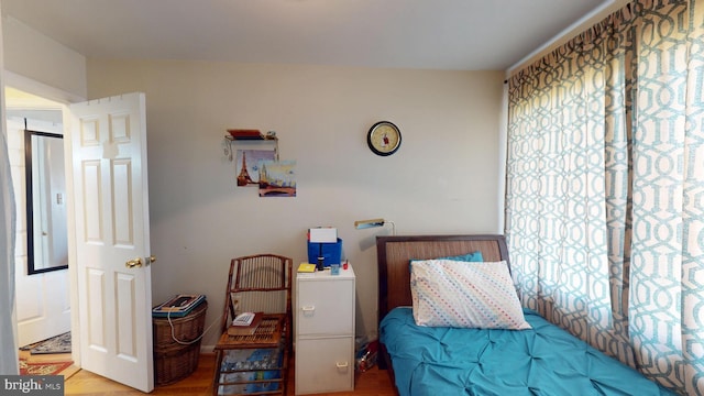 bedroom with wood finished floors