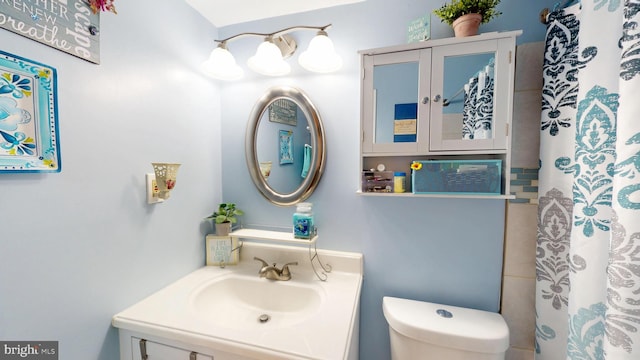 bathroom with vanity and toilet