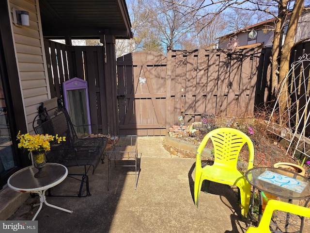 view of patio / terrace with a gate and fence