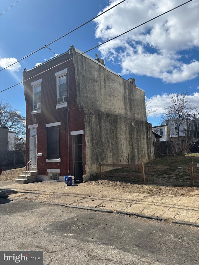 view of front facade featuring brick siding