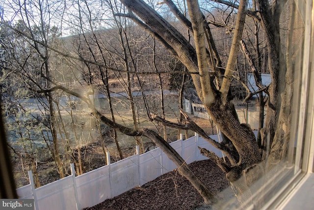 property view of water featuring fence