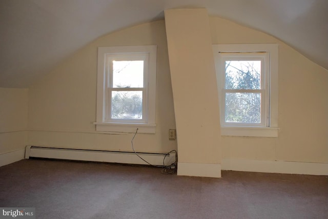 additional living space with lofted ceiling, carpet floors, and baseboard heating