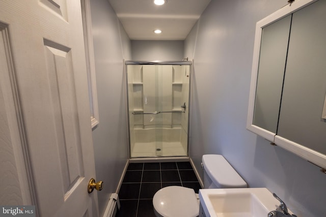 full bathroom with a sink, baseboard heating, a stall shower, and toilet