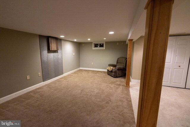 unfurnished room with recessed lighting, baseboards, and light carpet