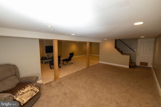 finished basement with carpet flooring, recessed lighting, stairs, and baseboards