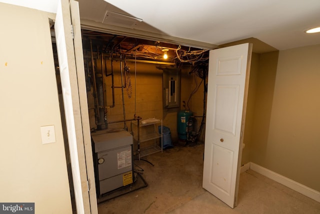 unfinished basement featuring washer / clothes dryer and baseboards