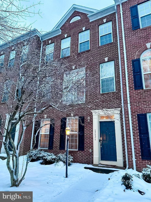 view of property with brick siding