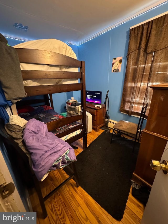 bedroom with wood finished floors