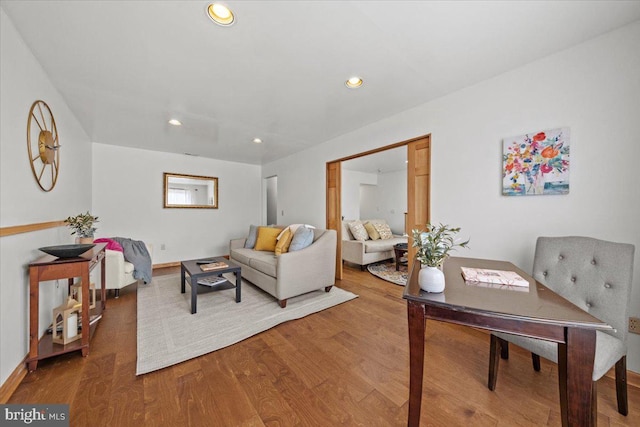 living area featuring wood finished floors and recessed lighting