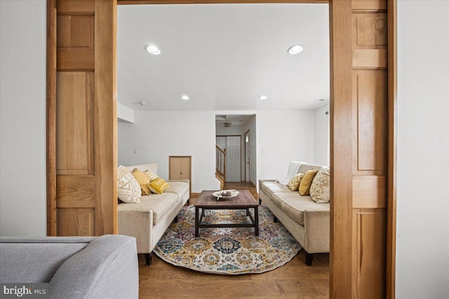 living room featuring stairs, wood finished floors, and recessed lighting