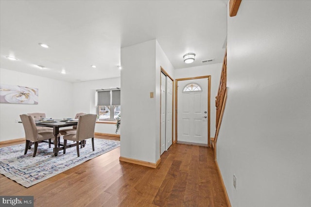 entryway featuring recessed lighting, visible vents, baseboards, and wood finished floors